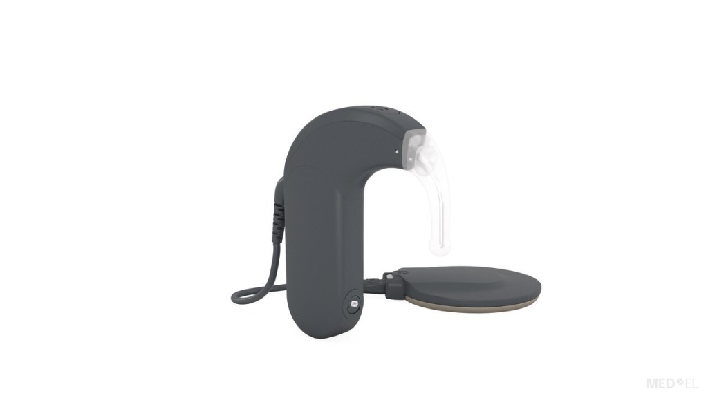 Sonnet 3 processor in black - a black behind the ear style processor with a circular magnet